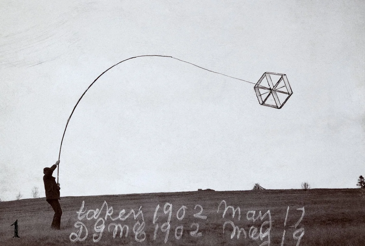 A single tetrahedral cell kite flying on a line above a field at Beinn Bhreagh, 17 May 1902