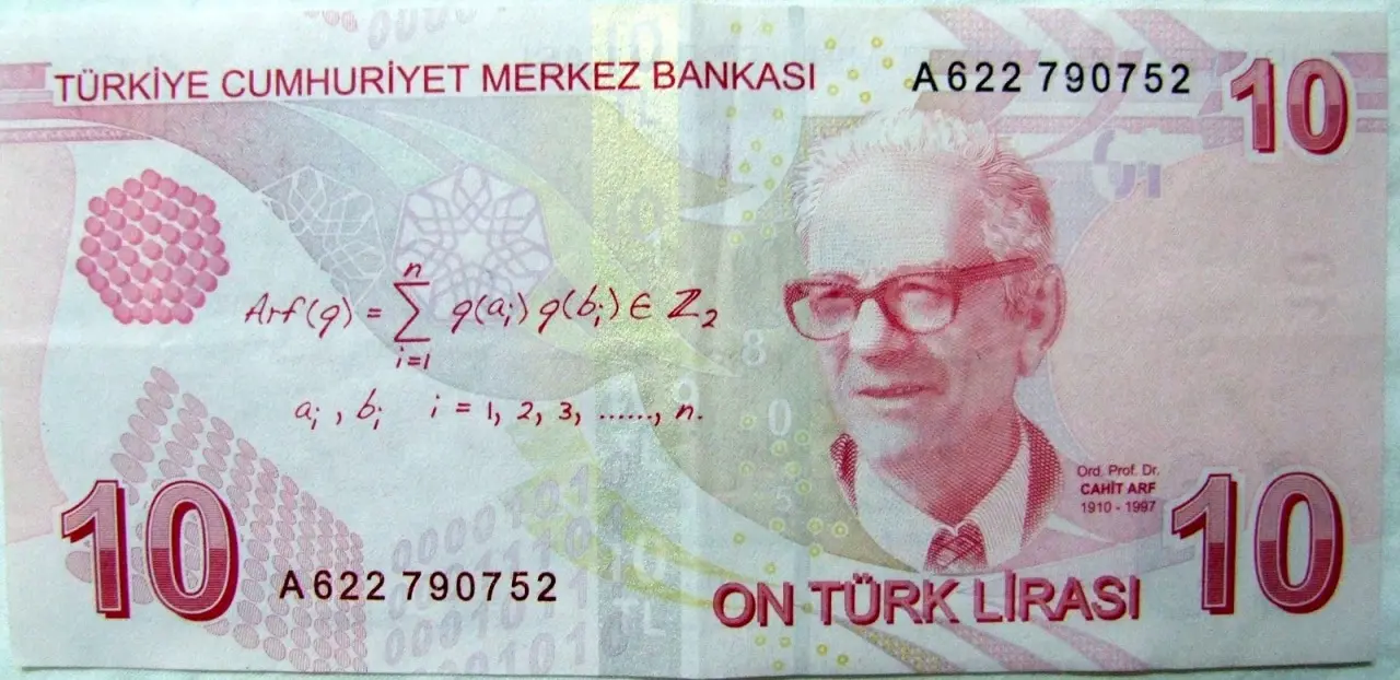 The back of a Turkish 10 lira banknote: a portrait of Cahit Arf on the right and, on the left, the handwritten formula Arf(q) equals the sum of q(a_i) q(b_i) in Z_2
