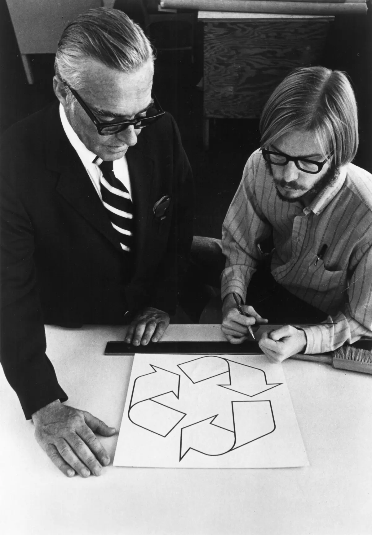 Gary Anderson's original sketch for the recycling logo — three chasing arrows forming a Möbius strip, with construction lines visible