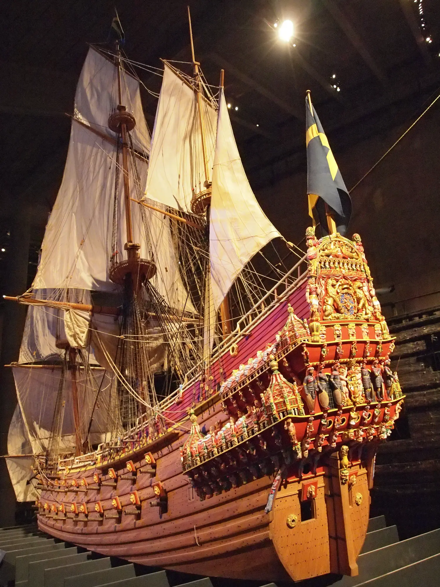 The 1:10 scale model of the Vasa with painted sculptures and full sails in the Vasa Museum